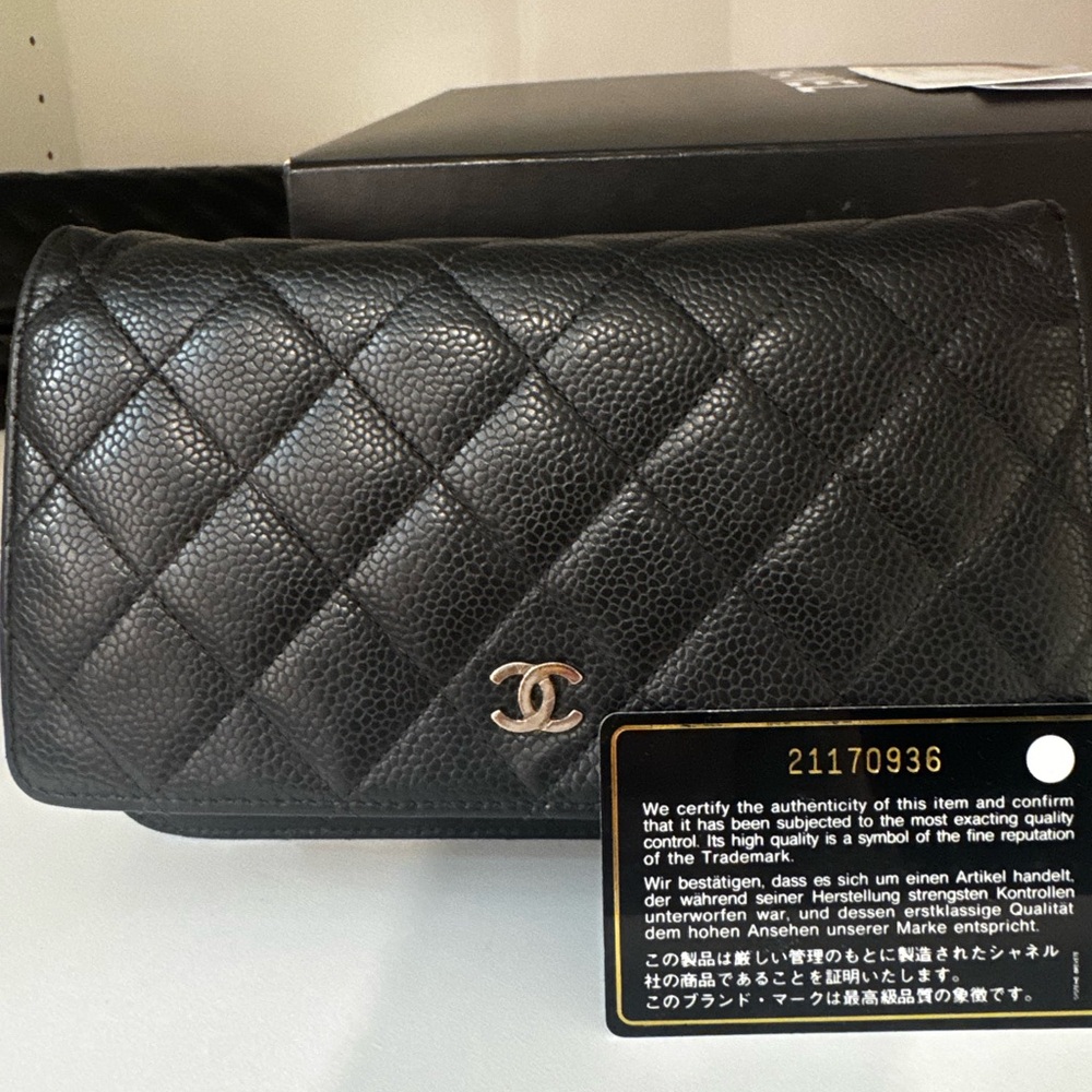 CHANEL Black Quilted Caviar Leather Wallet on Chain (WOC) with Silver Hardware.